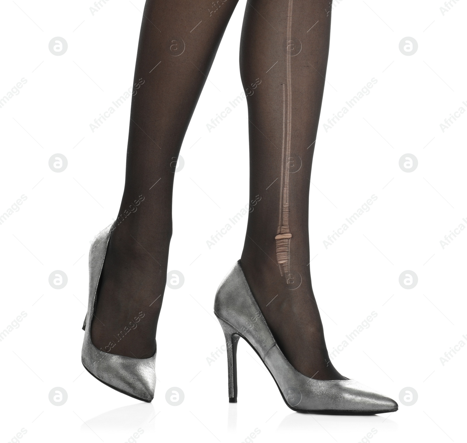 Photo of Woman wearing torn tights on white background, closeup