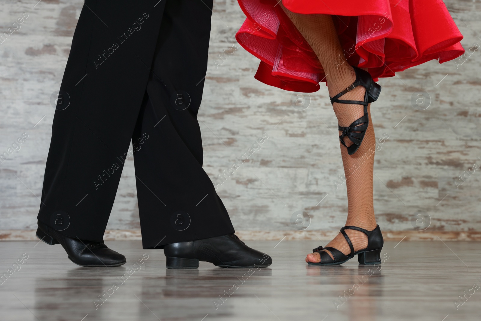 Photo of Couple of kids dancing together in studio, closeup