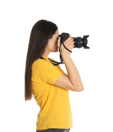Young female photographer with camera on white background