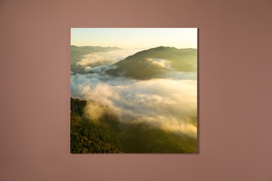 Image of Canvas with printed photo of mountain landscape on pale brown wall