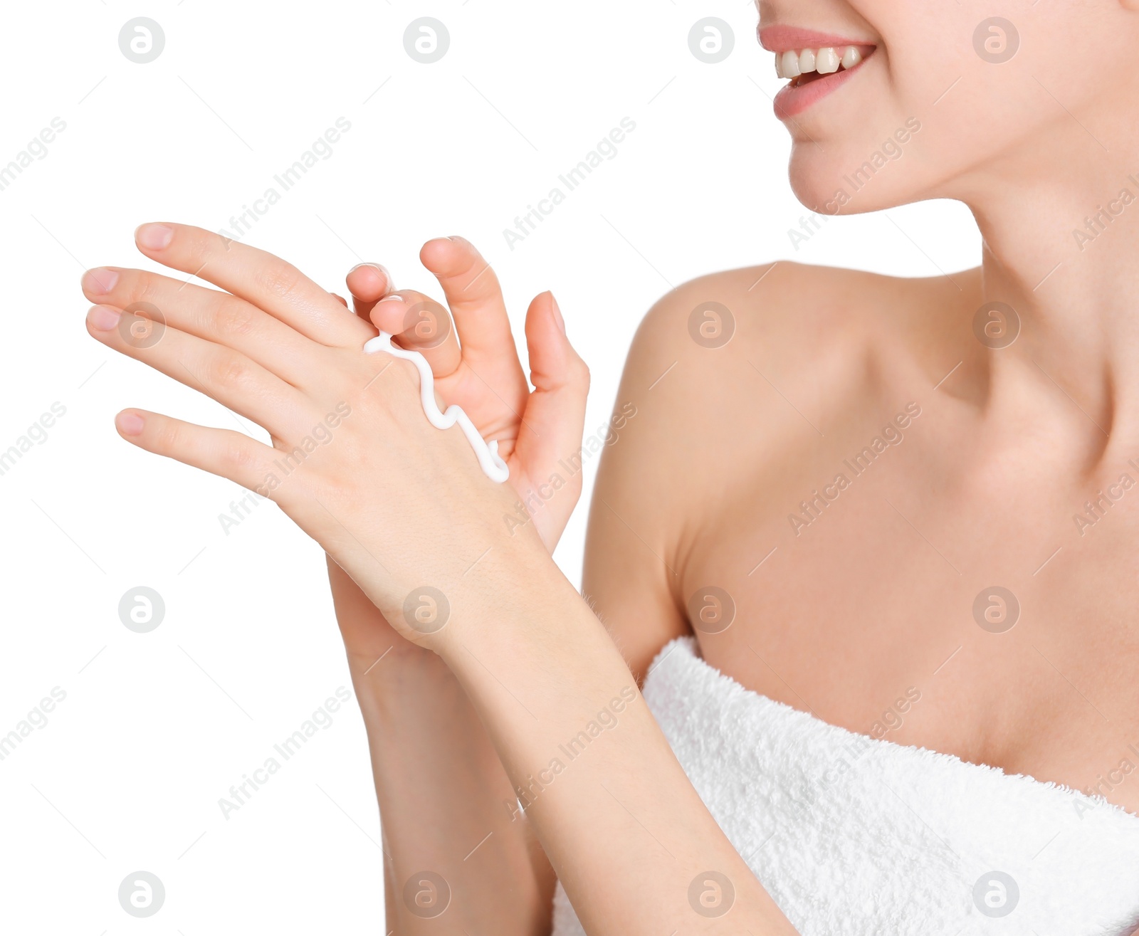 Photo of Young woman applying hand cream on white background