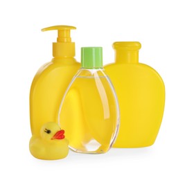Photo of Bottle of baby oil, other cosmetic products and rubber duck on white background