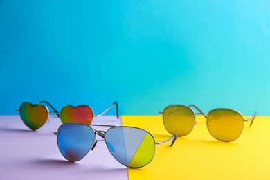 Stylish sunglasses on color background, space for text. Summer time