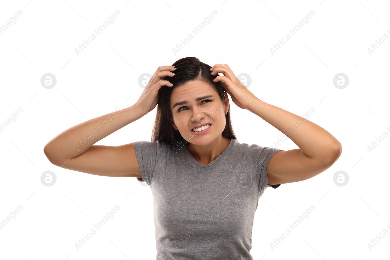 Photo of Emotional woman examining her hair and scalp on white background