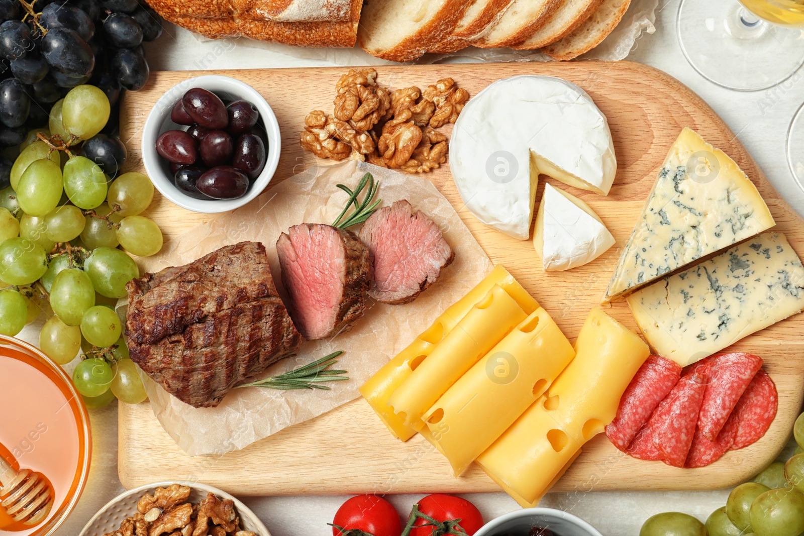 Photo of Flat lay composition with snacks for wine on white background