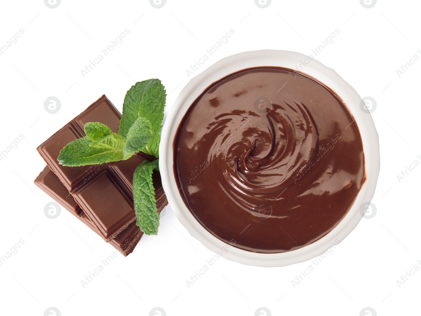 Photo of Sweet chocolate cream in dessert bowl, pieces and mint isolated on white, top view