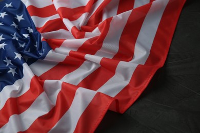 Photo of Flag of USA on black table, closeup