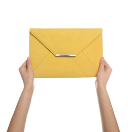 Woman holding stylish envelope bag on white background, closeup