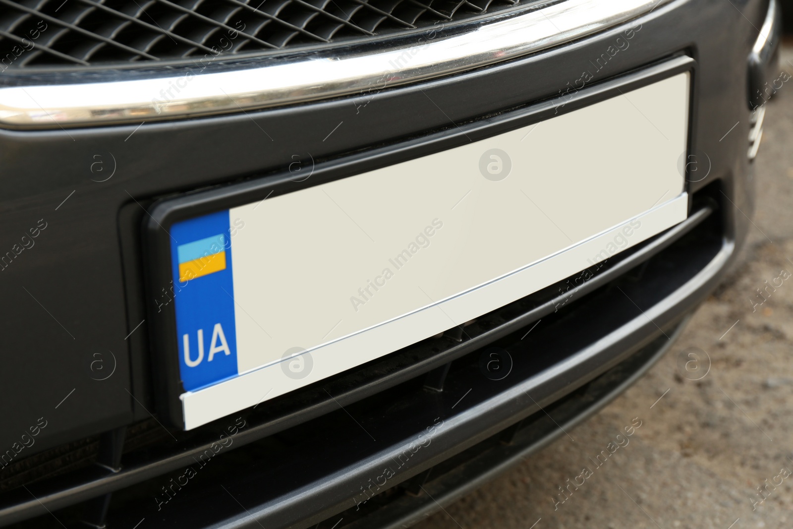 Photo of Car with vehicle registration plate outdoors, closeup