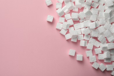 Photo of Many styrofoam cubes on pink background, flat lay. Space for text