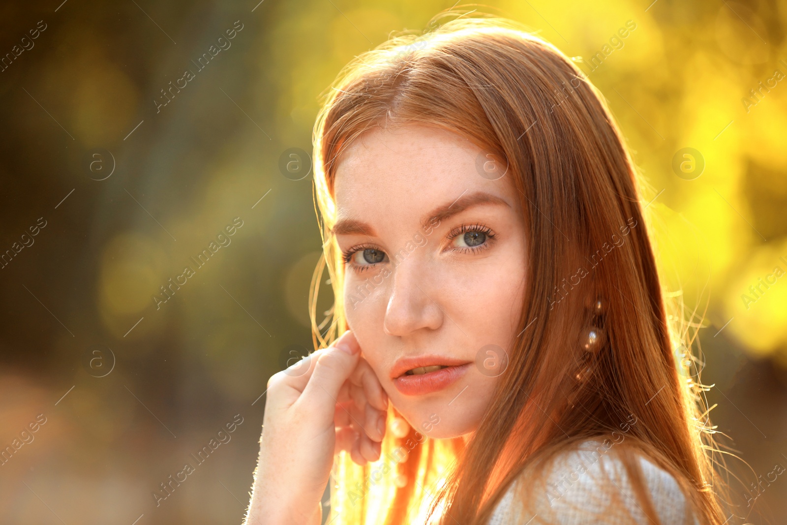 Photo of Beautiful young woman posing on blurred background