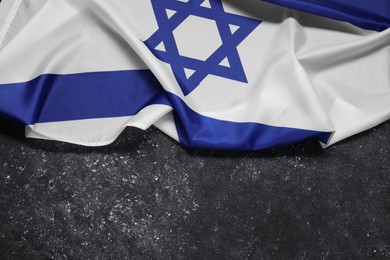 Photo of Flag of Israel on grey textured background, top view and space for text. National symbol