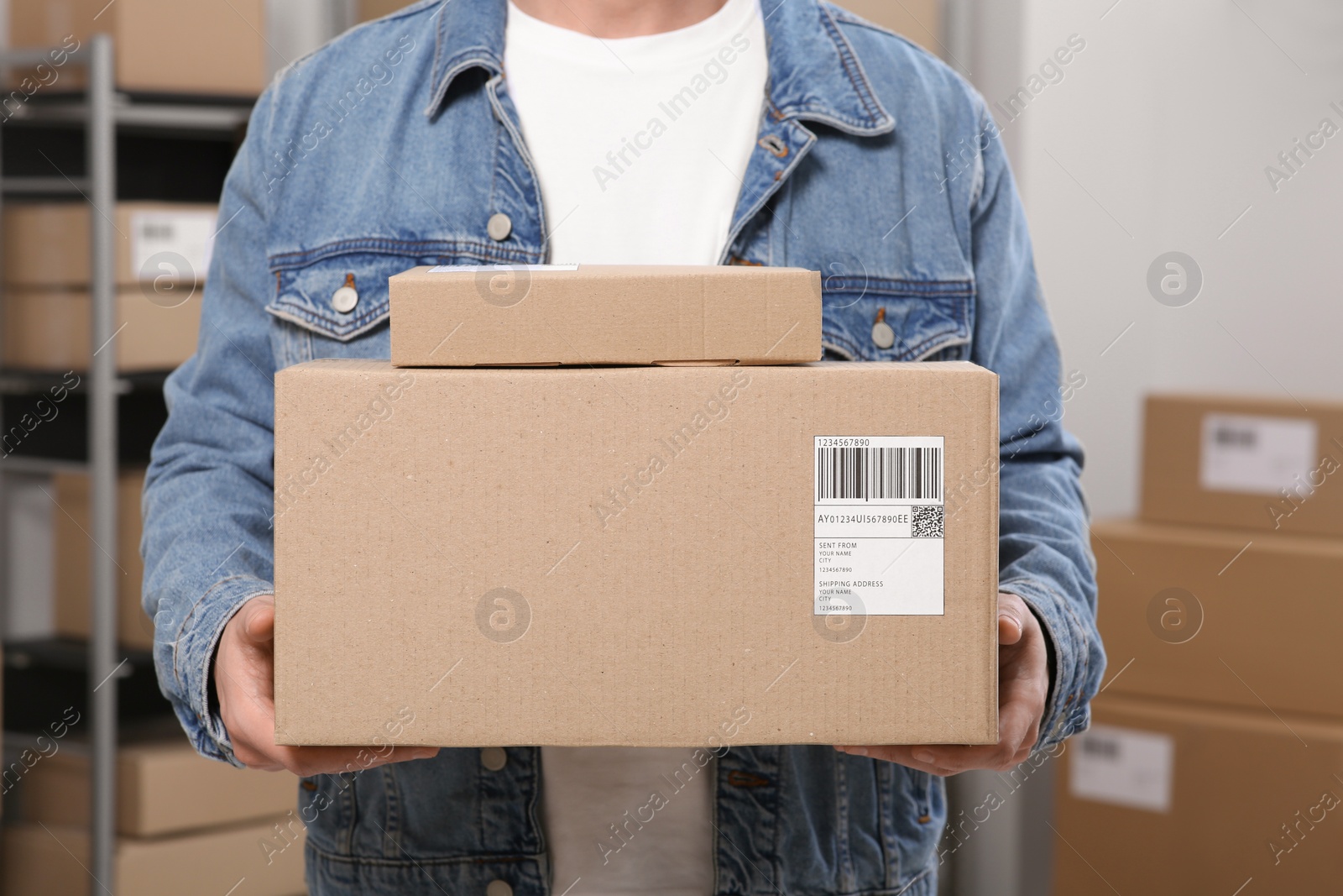 Photo of Seller with parcels in office, closeup. Online store