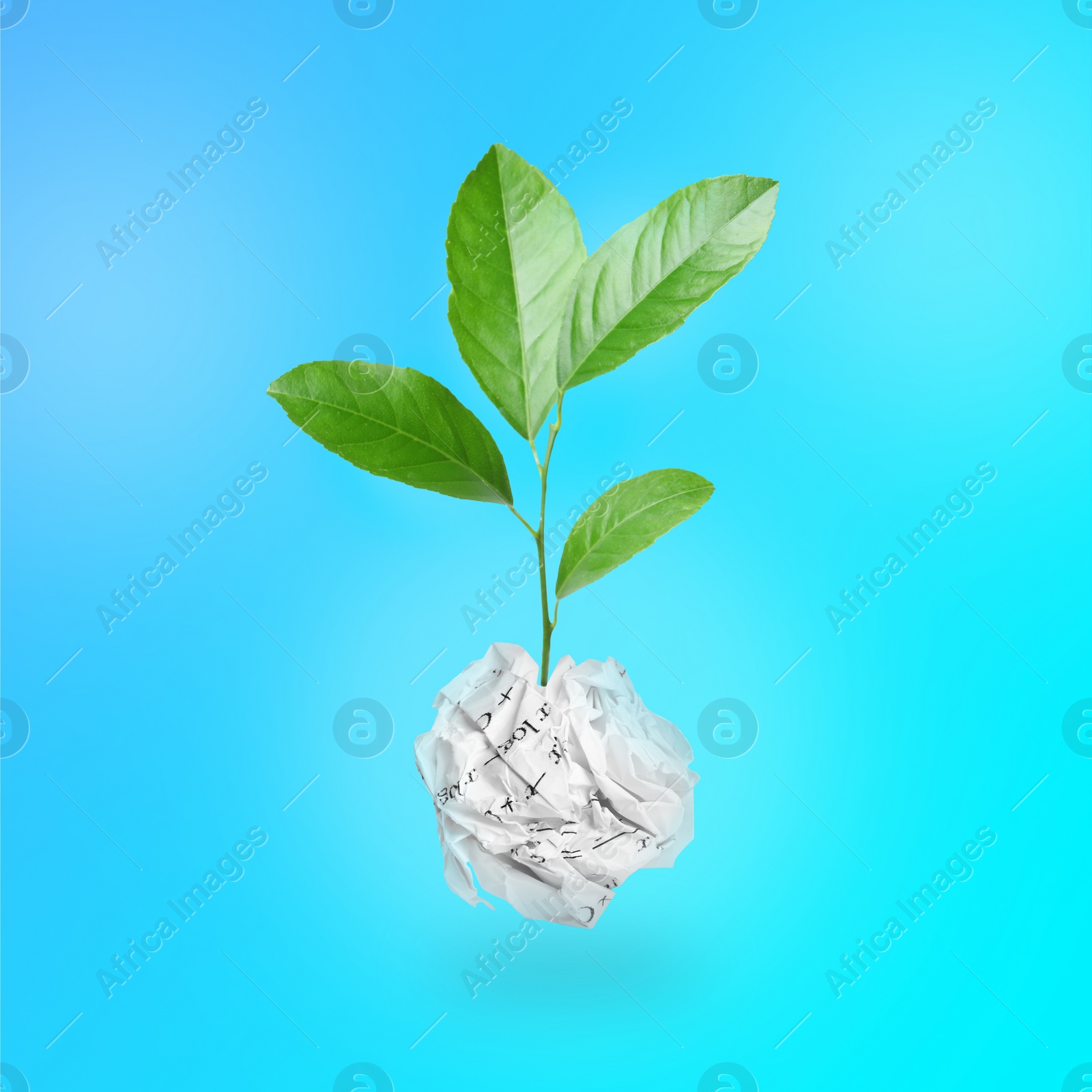 Image of Crumpled sheet of paper on twig with green leaves on turquoise background. Recycling concept