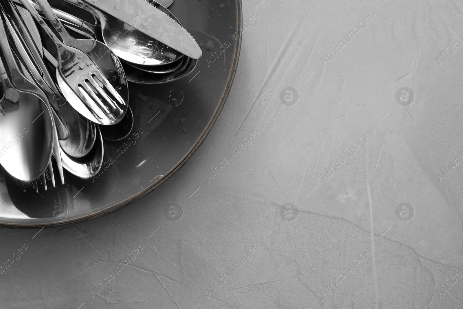 Photo of Different clean kitchenware on light grey table, top view. Space for text