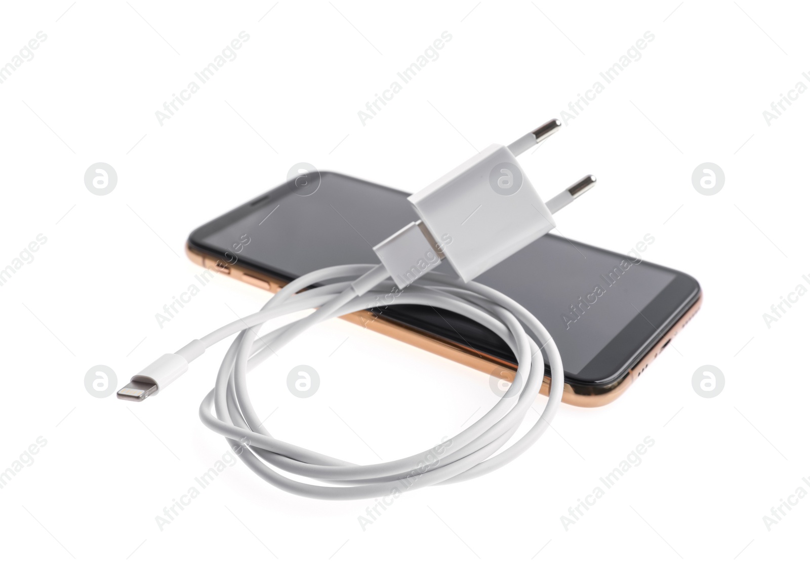 Photo of Smartphone and USB charger isolated on white. Modern technology