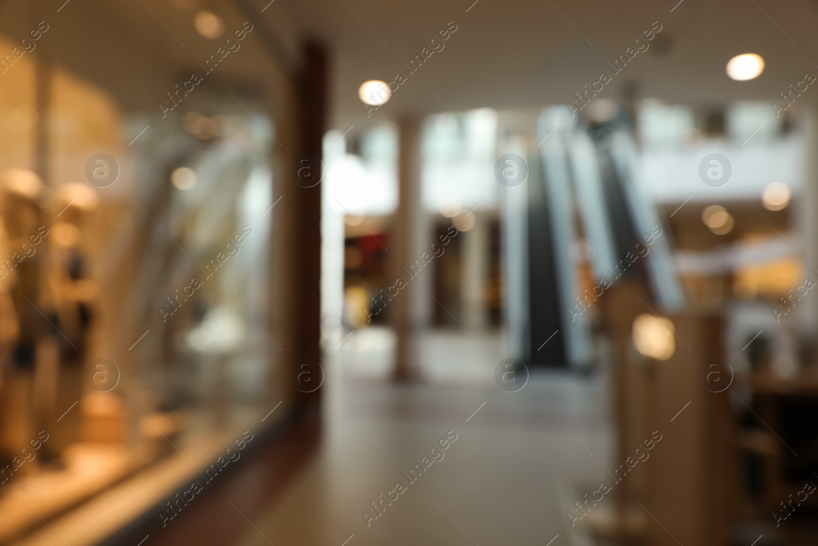 Photo of Blurred view of shopping mall interior. Bokeh effect