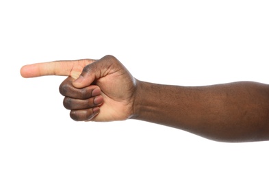 African-American man pointing at something on white background, closeup