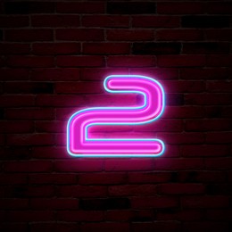 Image of Glowing neon number 2 sign on brick wall