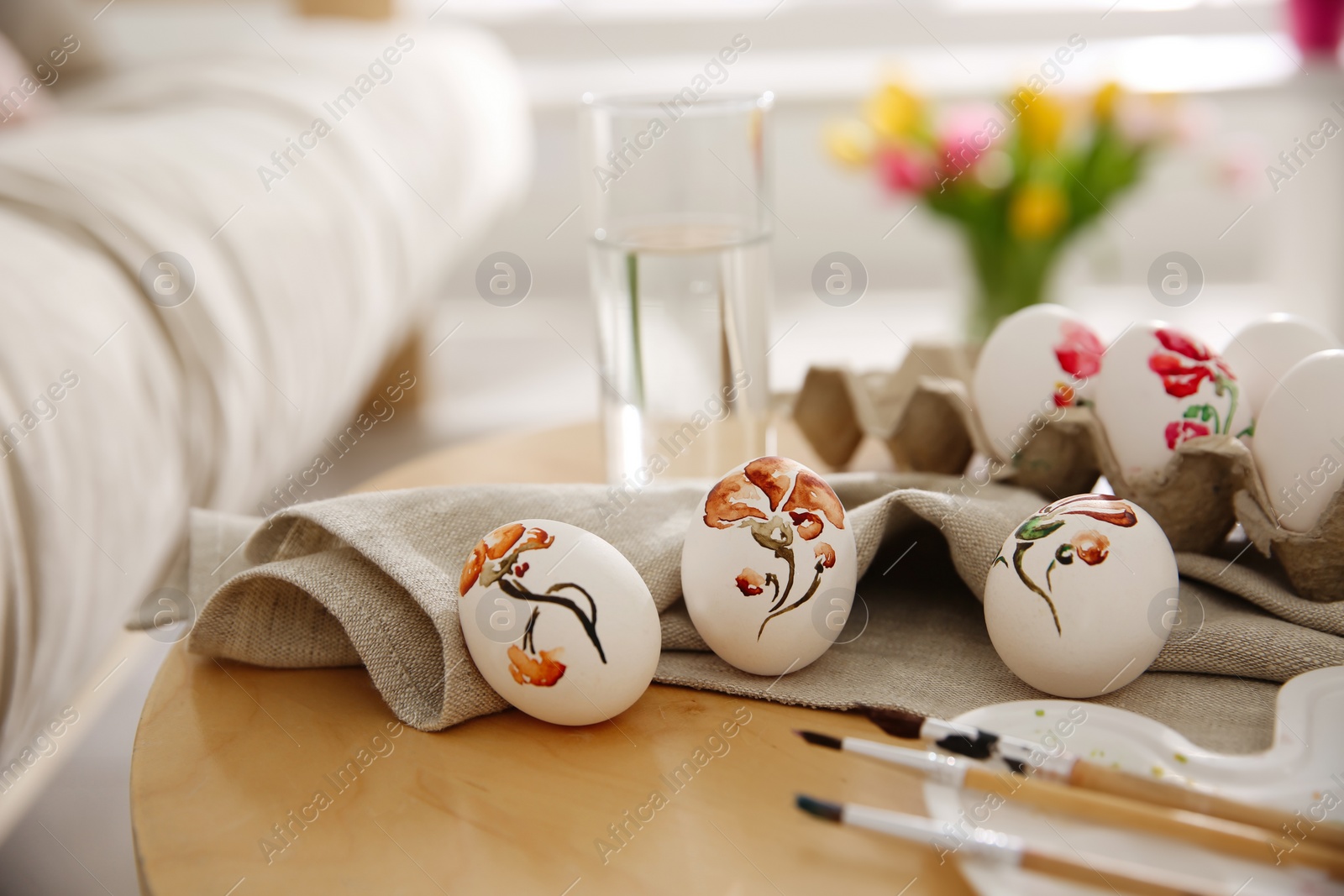 Photo of Beautifully painted Easter eggs on wooden table