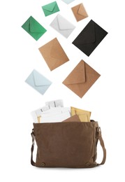 Many different envelopes falling into brown postman's bag on white background