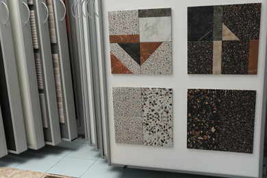 Samples of tiles with different patterns on display in store