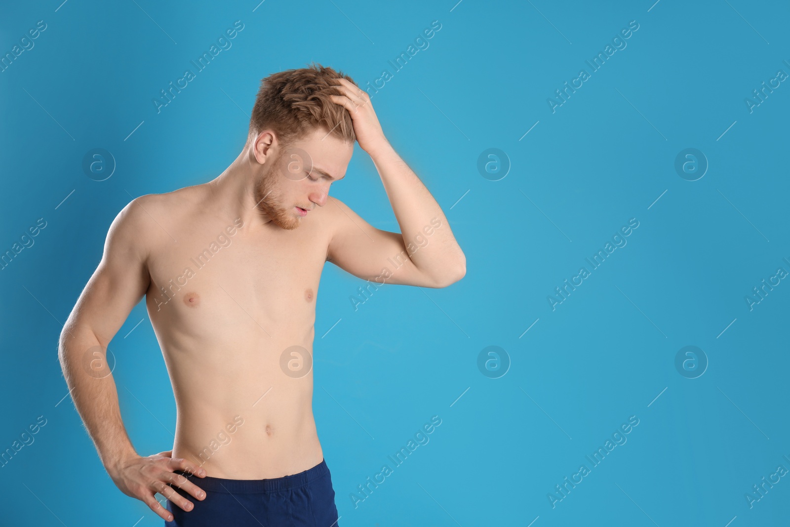 Photo of Handsome man with slim body on color background. Space for text