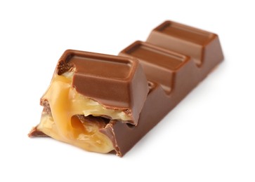 Photo of Pieces of delicious chocolate bar on white background