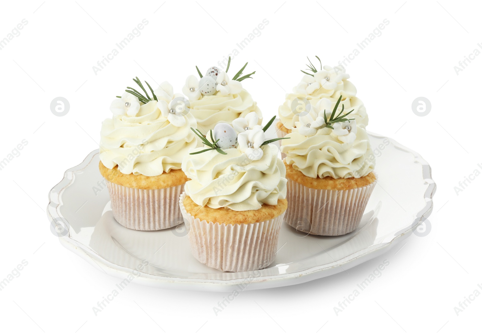 Photo of Tasty Easter cupcakes with vanilla cream isolated on white