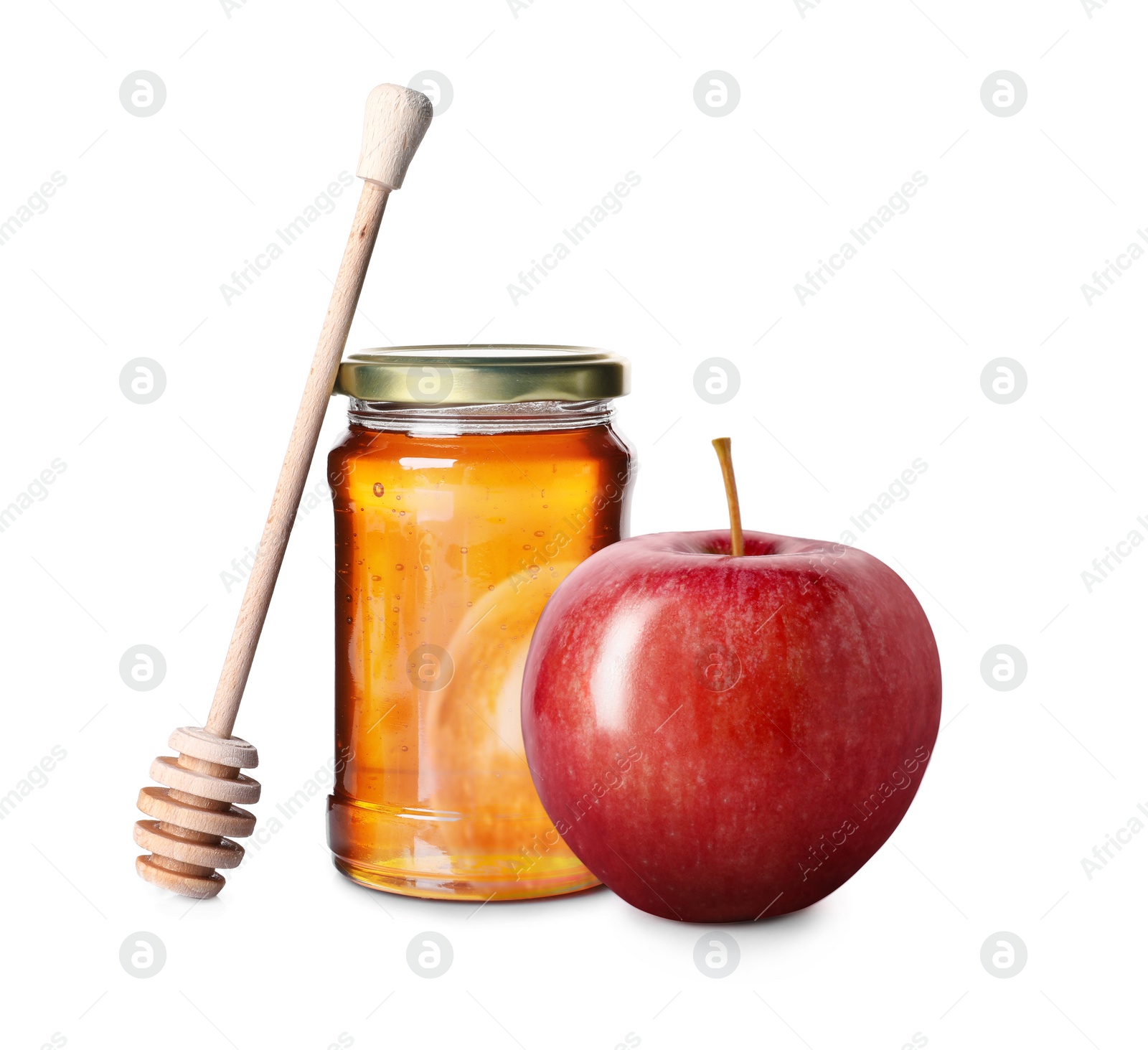 Image of Honey in glass jar, apple and dipper isolated on white