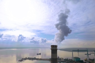 Polluting air with smoke, aerial view of industrial factory. CO2 emissions