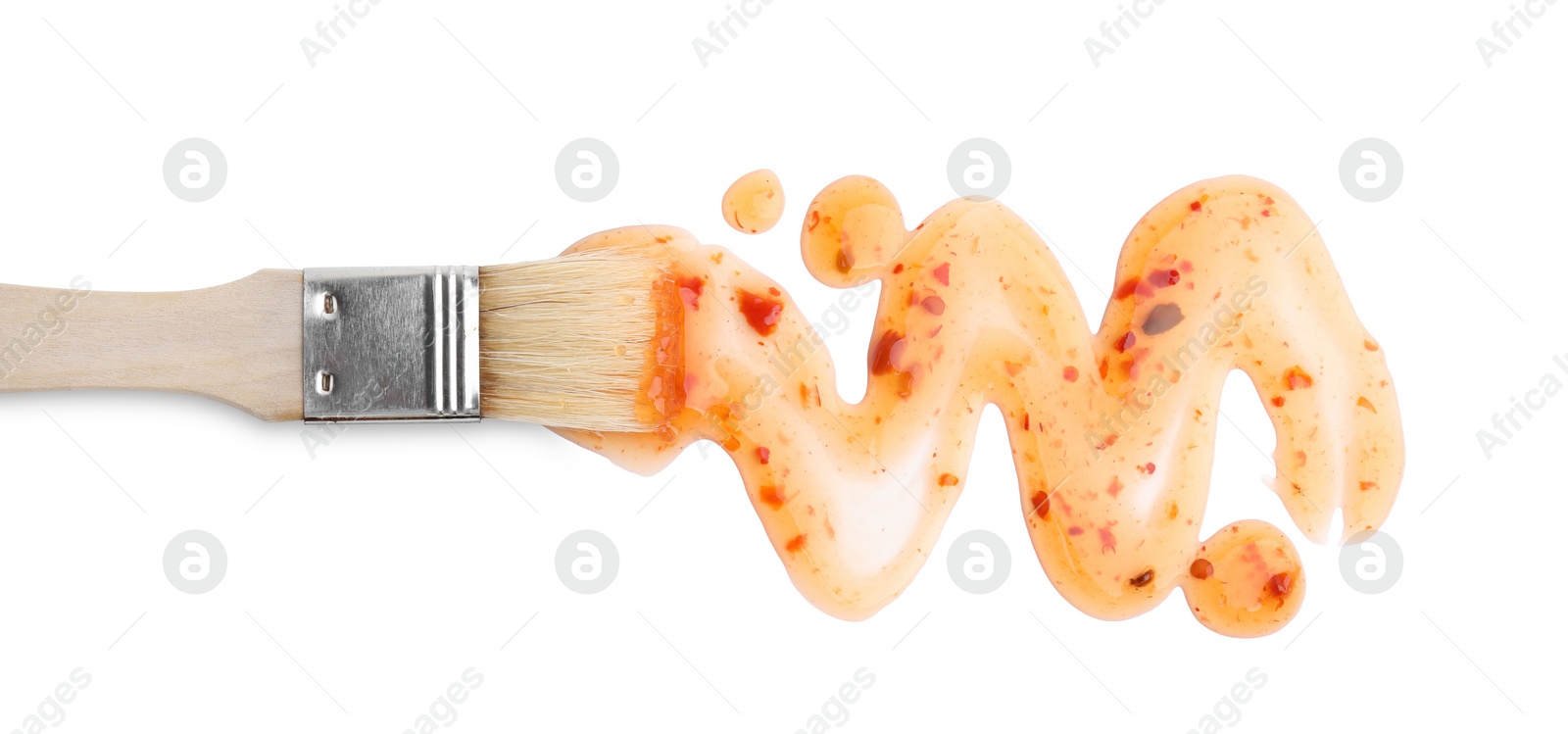 Photo of Basting brush with fresh marinade isolated on white, top view