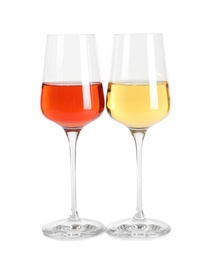 Photo of Glasses of different delicious expensive wines on white background