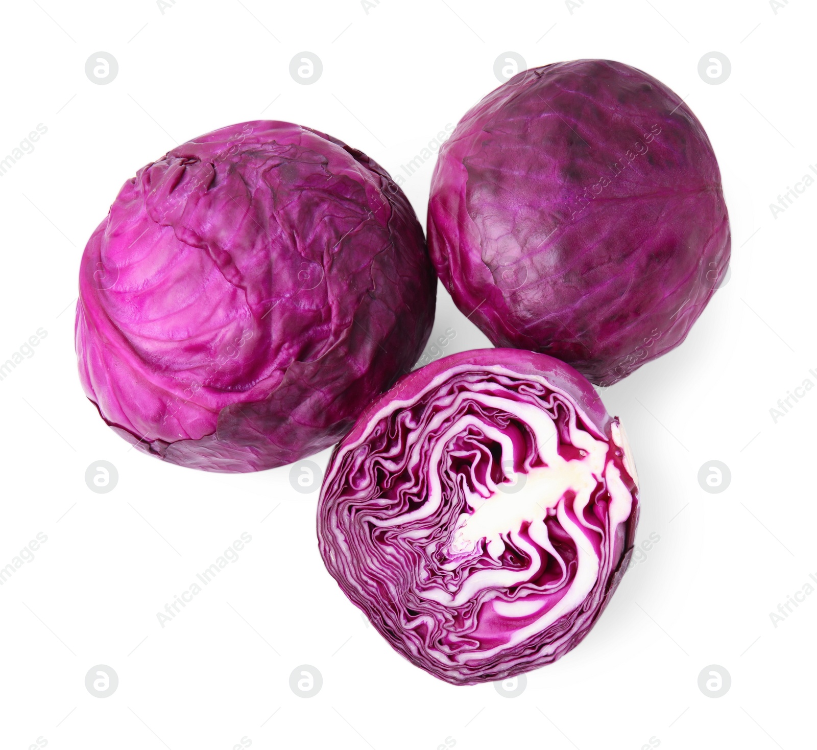 Photo of Whole and cut fresh red cabbages isolated on white, top view