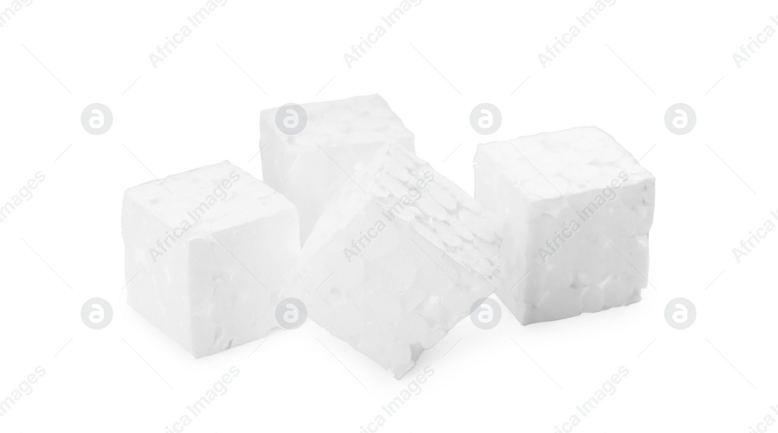 Photo of Many small styrofoam cubes on white background