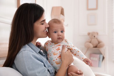 Mother with her cute baby at home