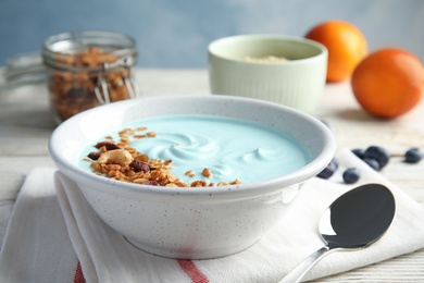 Bowl of spirulina smoothie served on table