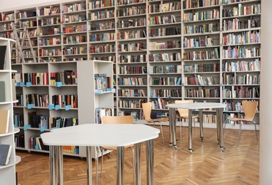 Photo of View of bookshelves and tables in library