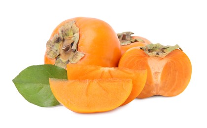 Photo of Whole and cut delicious ripe juicy persimmons on white background