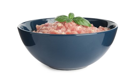 Photo of Raw chicken minced meat with basil in bowl on white background