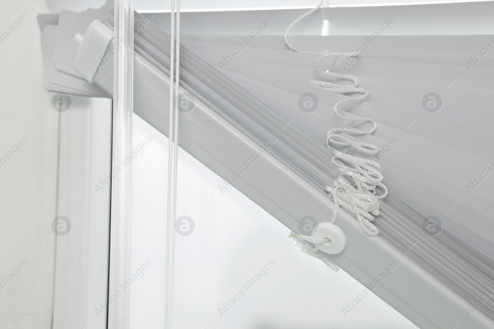 Photo of Closeup view of stylish horizontal window blinds