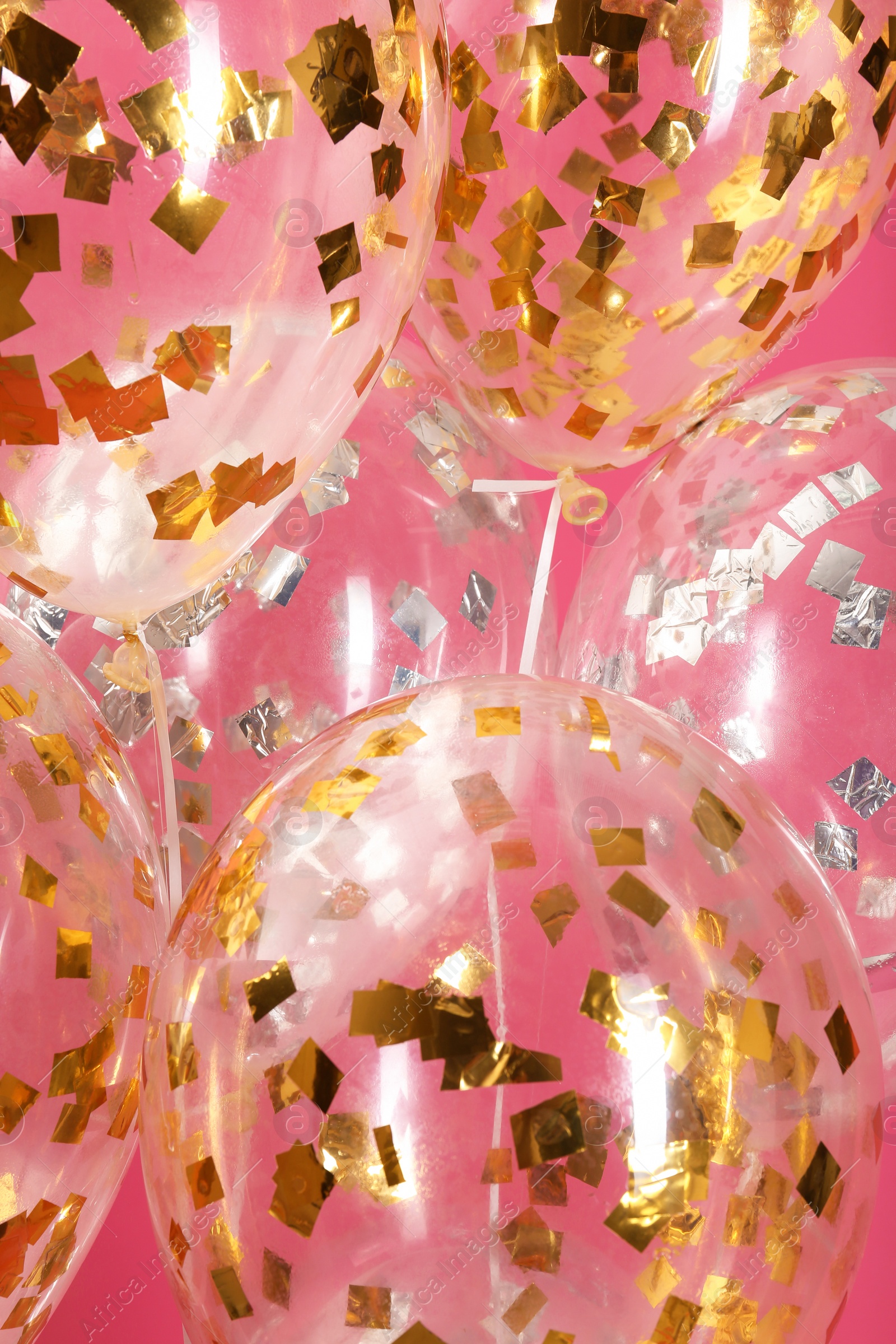 Photo of Balloons with sparkles on color background, closeup