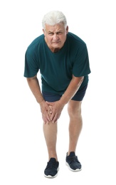 Photo of Full length portrait of senior man having knee problems on white background