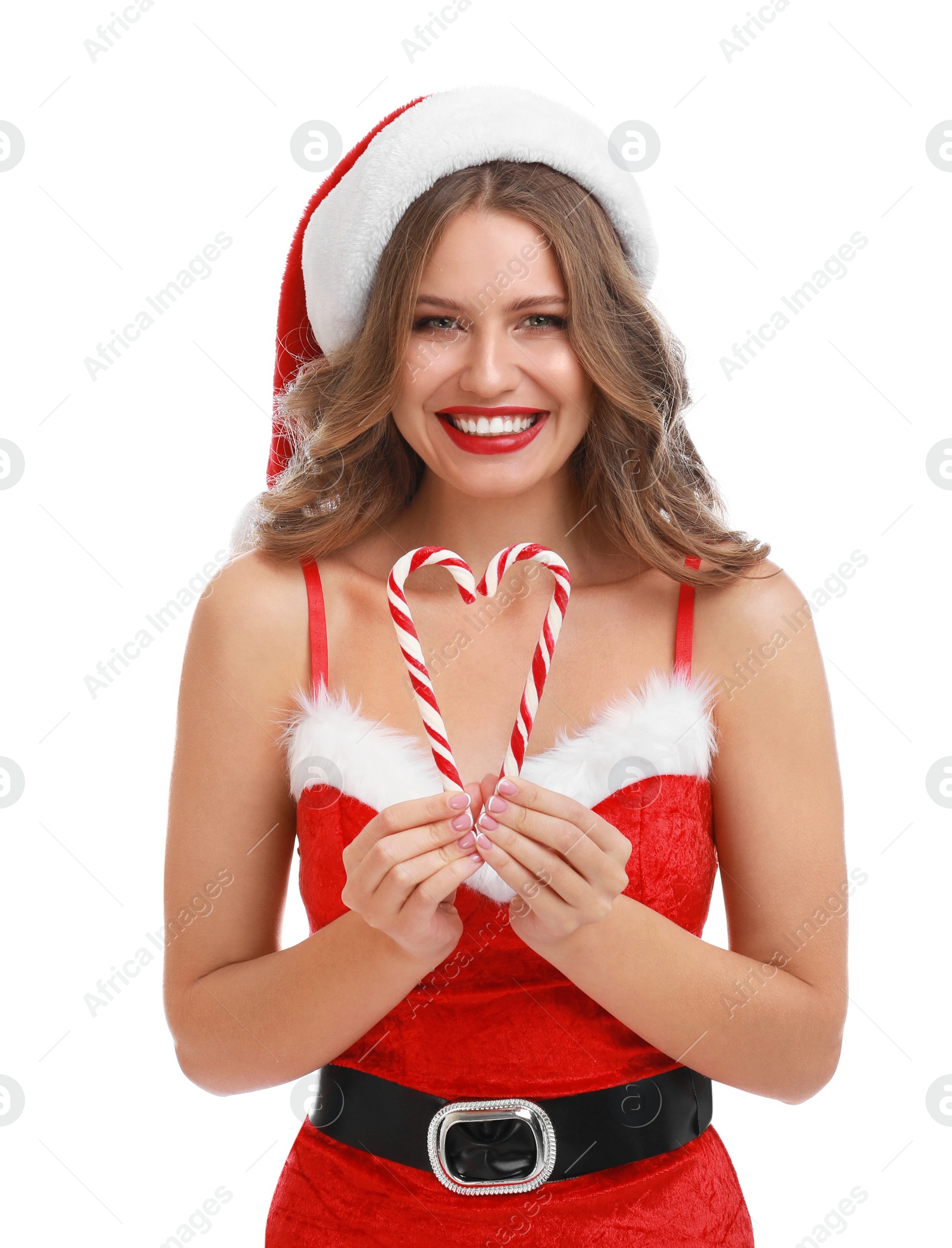 Photo of Beautiful Santa girl with candy canes on white background. Christmas celebration