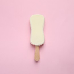 Ice cream with glaze on pink background, top view