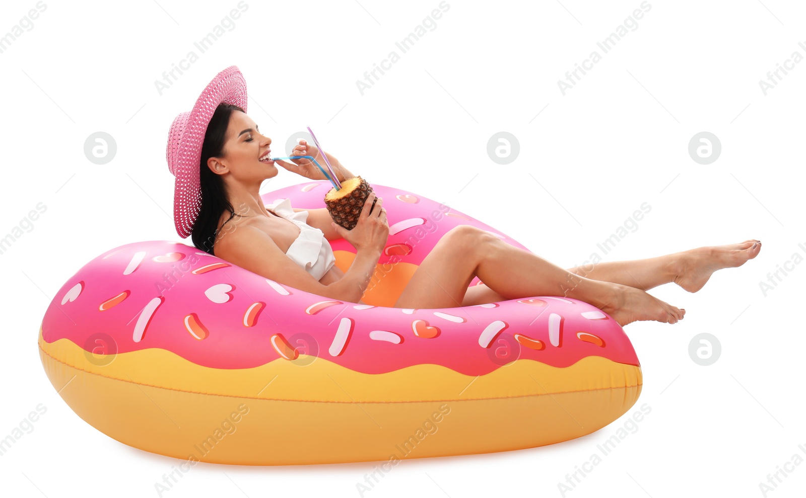 Photo of Beautiful young woman in stylish bikini with cocktail and inflatable ring on white background