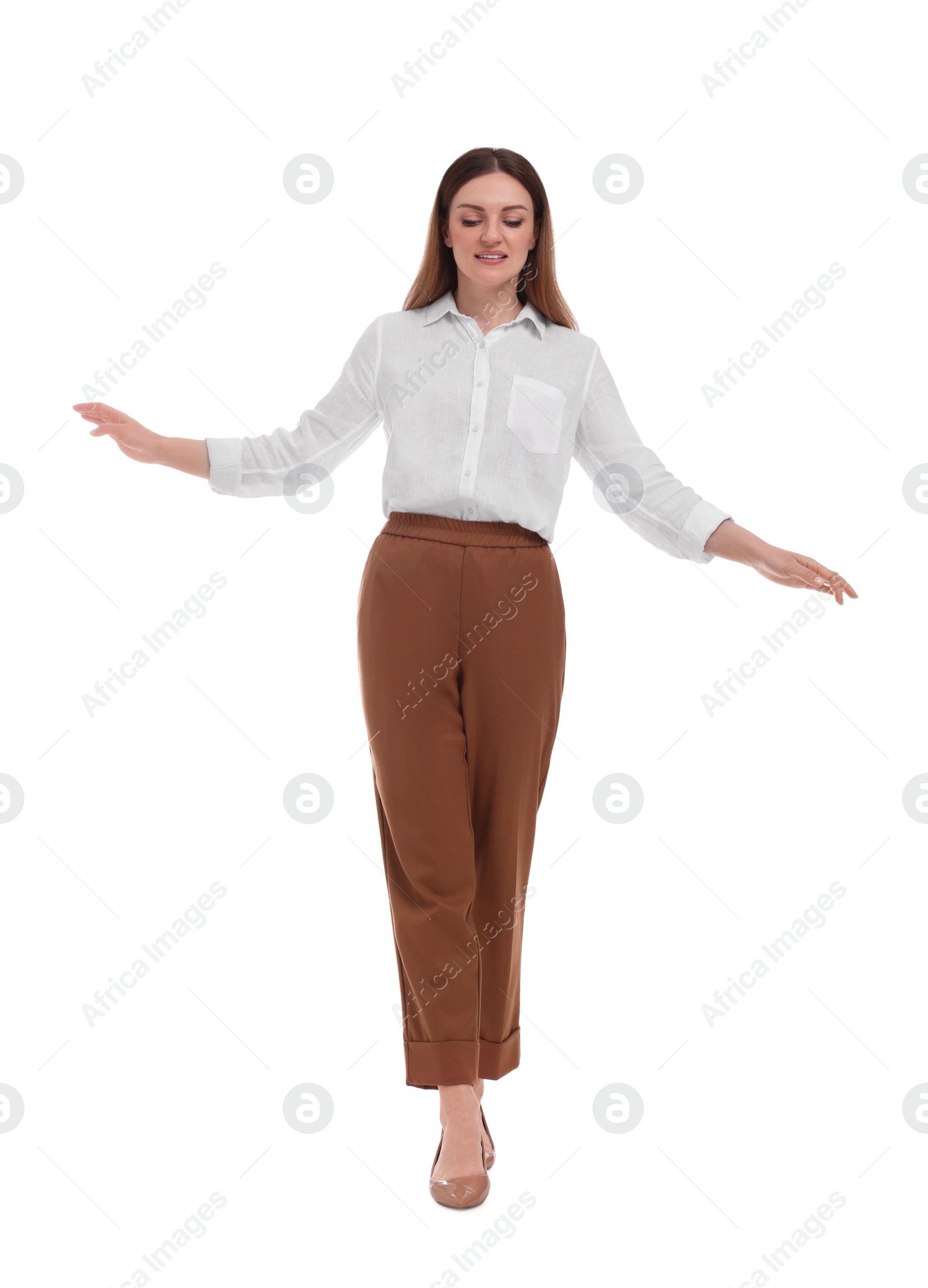 Photo of Beautiful happy businesswoman walking on white background