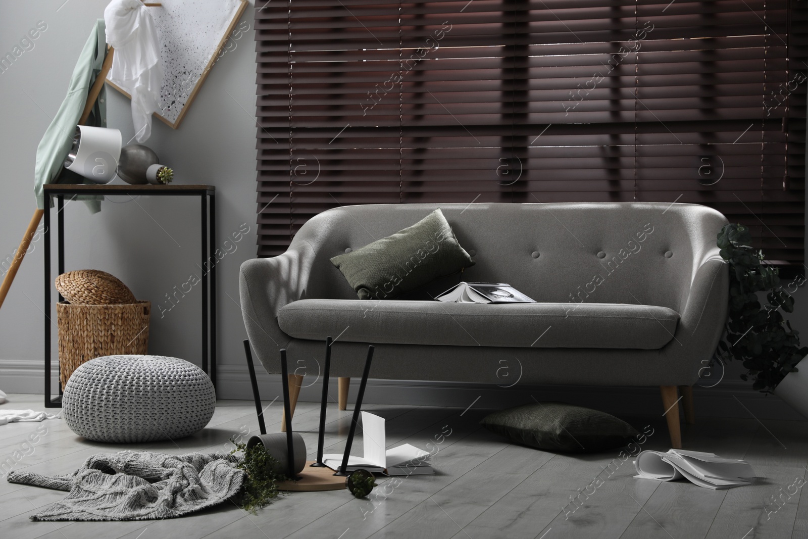 Photo of Chaotic living room interior after strong earthquake