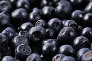 Many delicious ripe bilberries as background, closeup