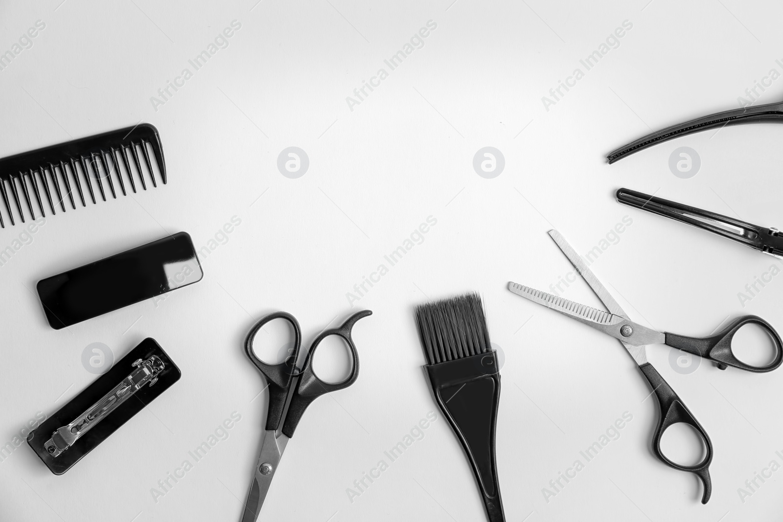 Photo of Professional hairdresser tools on white background